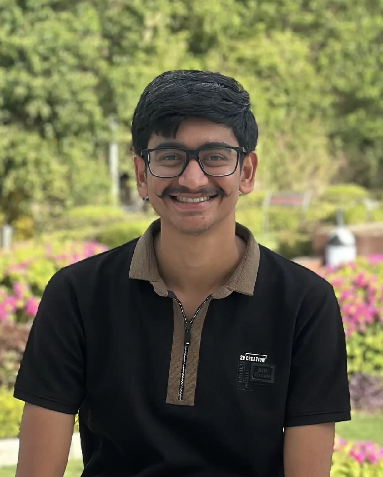 Sagar Harkhani smiling, shown from the chest up